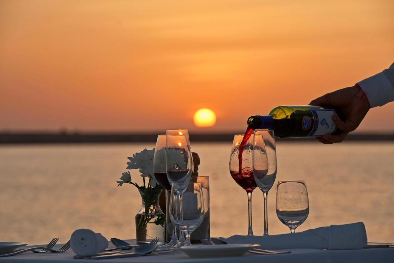 Fanar Hotel & Residences Salalah Exterior photo Sunset dinner at the beach