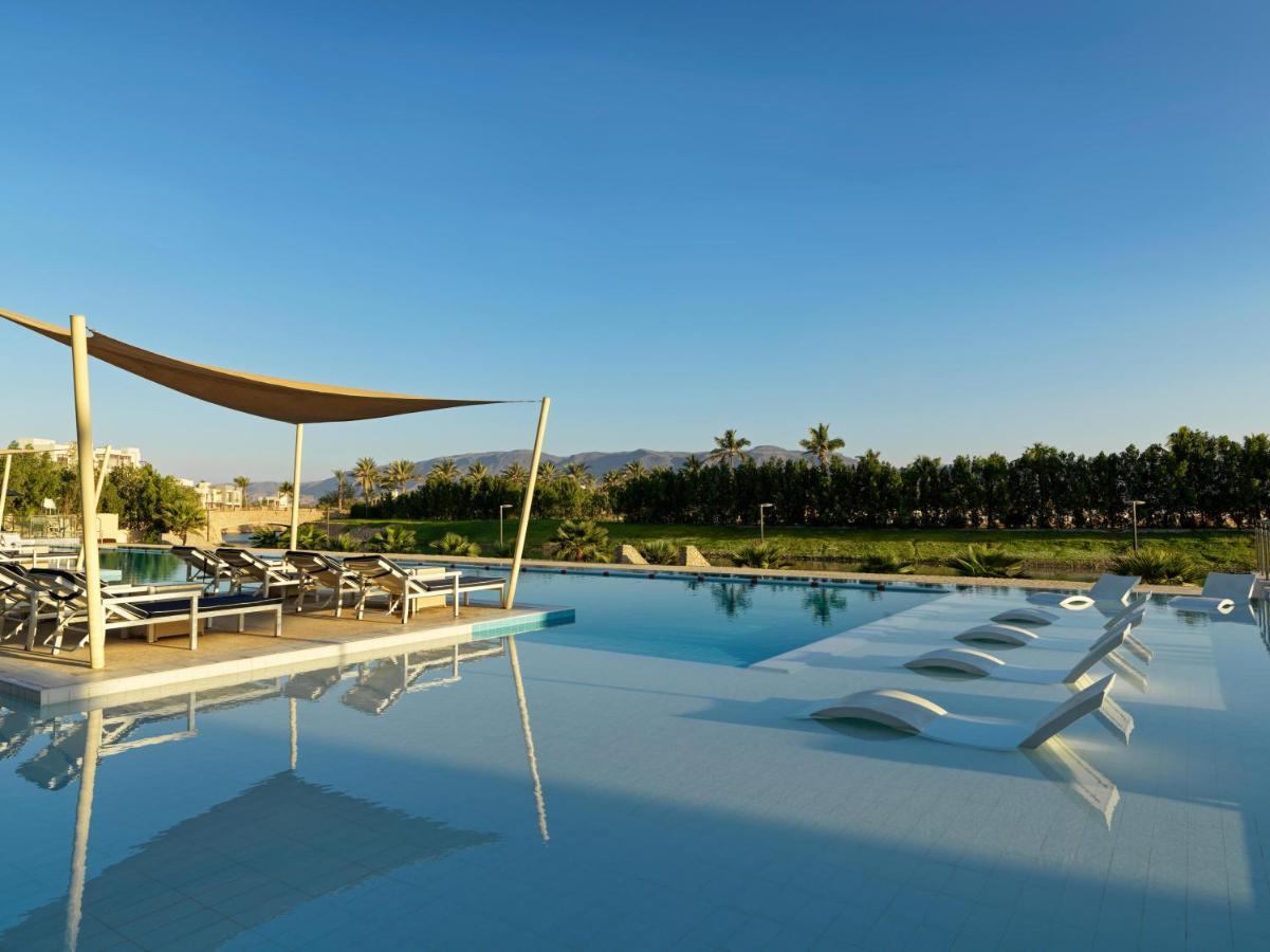 Fanar Hotel & Residences Salalah Exterior photo The swimming pool at the hotel