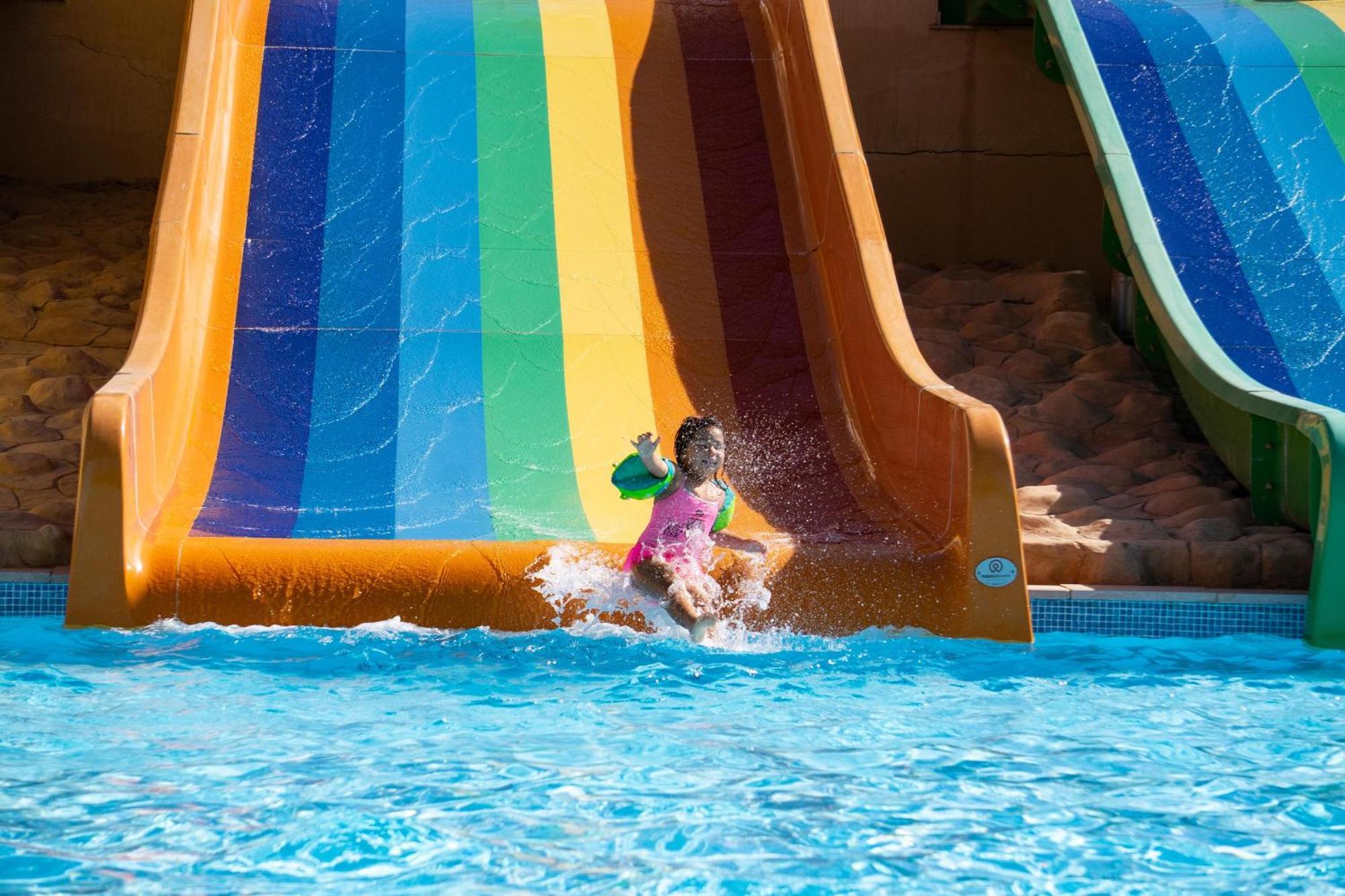 Fanar Hotel & Residences Salalah Exterior photo A child on a water slide